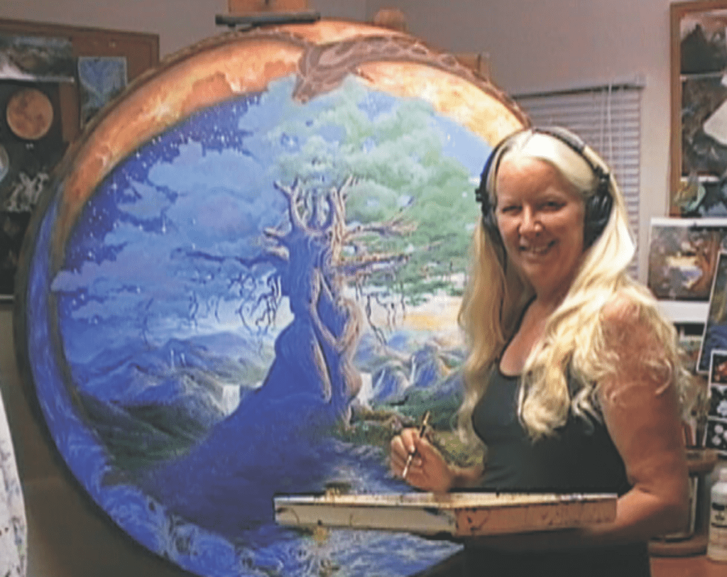 Linda Gadbois painting "Tree of Life" in her studio